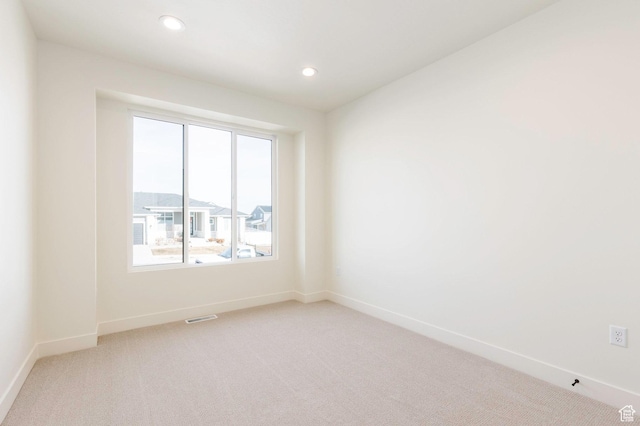 7277 W Hall Crossing Dr S, Herriman, UT 84096 - unfurnished room featuring visible vents, baseboards, recessed lighting, and light colored carpet