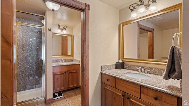 840 Bigler Ln W Unit 3023, Midway, UT 84049 - bathroom with walk in shower, tile patterned flooring, and vanity