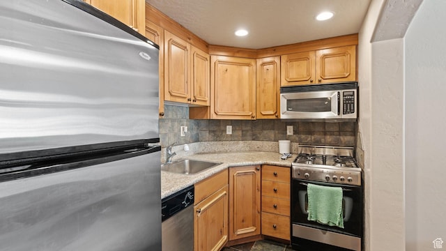 840 Bigler Ln W Unit 3023, Midway, UT 84049 - kitchen featuring stainless steel appliances, sink, tasteful backsplash, and light stone countertops