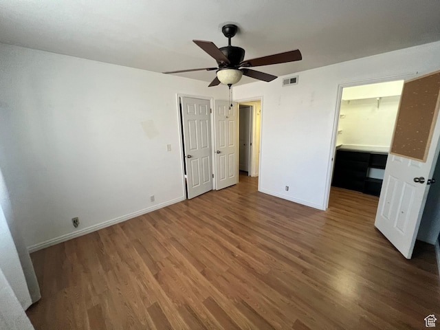 989 E Creekhill Ln S Unit 31, Midvale, UT 84047 - unfurnished bedroom with ceiling fan and dark hardwood / wood-style flooring
