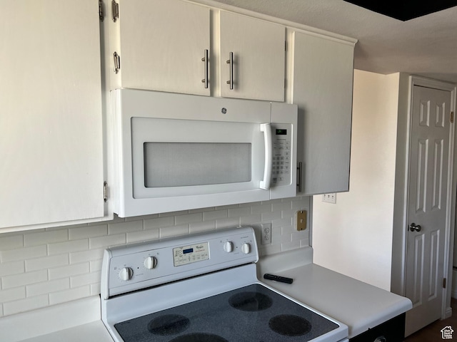 989 E Creekhill Ln S Unit 31, Midvale, UT 84047 - kitchen featuring white appliances and backsplash