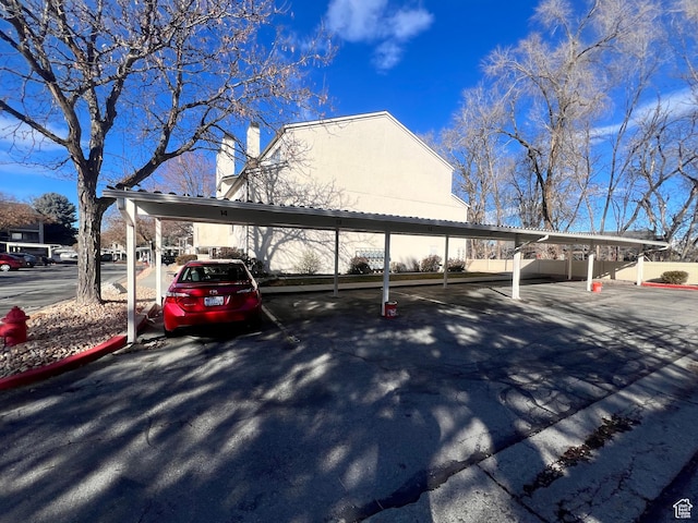 989 E Creekhill Ln S Unit 31, Midvale, UT 84047 - view of vehicle parking featuring a carport
