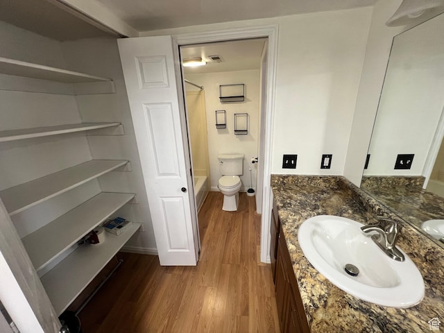 989 E Creekhill Ln S Unit 31, Midvale, UT 84047 - full bathroom with toilet, vanity, hardwood / wood-style floors, and shower / bathtub combination