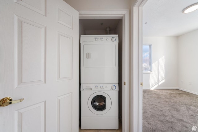 502 S 1040 E Unit 243, American Fork, UT 84003 - washroom featuring stacked washer and dryer and light carpet