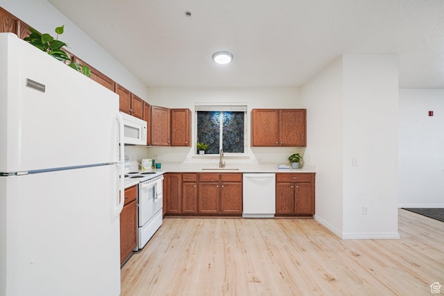 502 S 1040 E Unit 243, American Fork, UT 84003 - kitchen featuring white appliances, light wood-type flooring, and sink