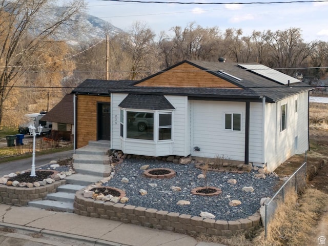 view of front of property with a fire pit