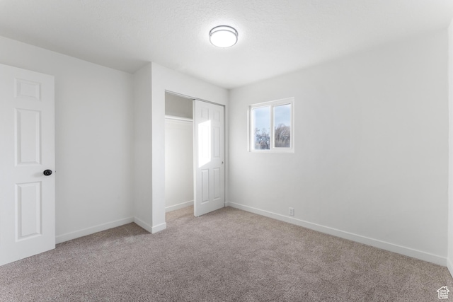 225 8th St, Ogden, UT 84404 - unfurnished bedroom with light colored carpet and a closet