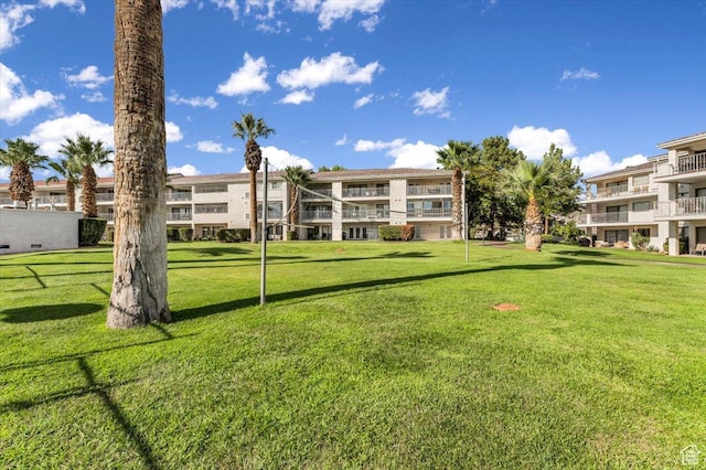 view of home's community featuring a lawn