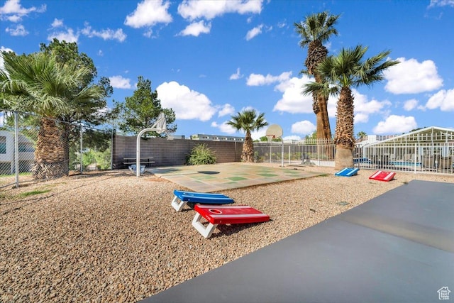 view of jungle gym with basketball court