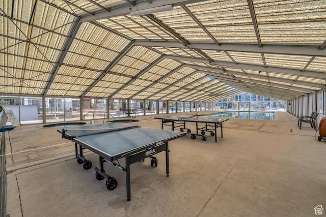recreation room featuring lofted ceiling
