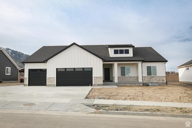 1336 E 1220 N, Logan, UT 84321 - modern inspired farmhouse featuring concrete driveway, stone siding, roof with shingles, and an attached garage