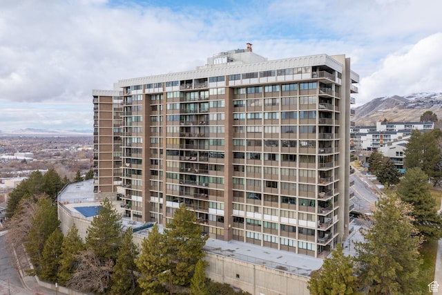 view of building exterior featuring a mountain view