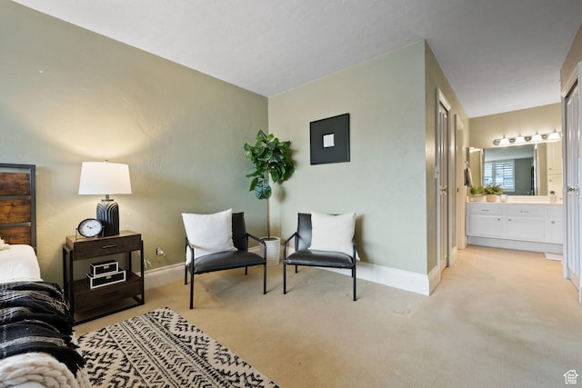 living area featuring light colored carpet