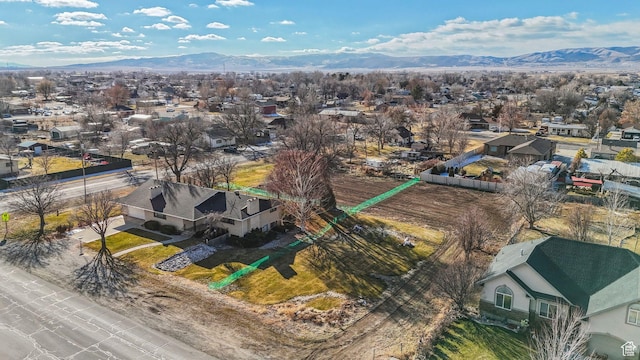 birds eye view of property featuring a mountain view