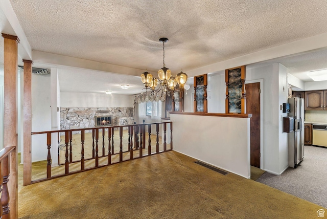 corridor featuring carpet and a chandelier