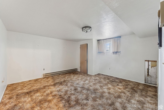 carpeted spare room featuring a baseboard radiator