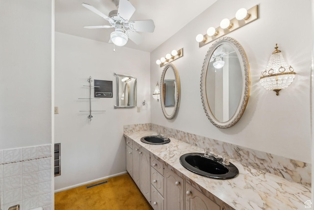 bathroom with ceiling fan and vanity