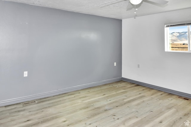 4752 E Max Rd, Downey, ID 83234 - empty room featuring light wood-type flooring, ceiling fan, and a textured ceiling