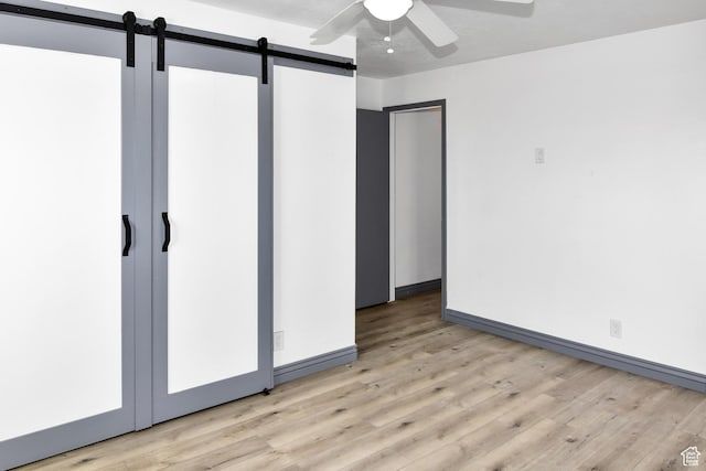 4752 E Max Rd, Downey, ID 83234 - spare room featuring ceiling fan and a barn door
