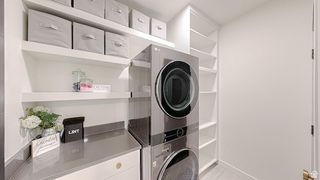 1244 N Washougal, Elk Ridge, UT 84651 - laundry area with stacked washer and clothes dryer and light tile patterned flooring