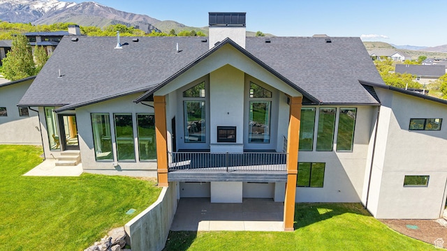 1244 N Washougal, Elk Ridge, UT 84651 - rear view of house featuring a chimney, stucco siding, a mountain view, and roof with shingles