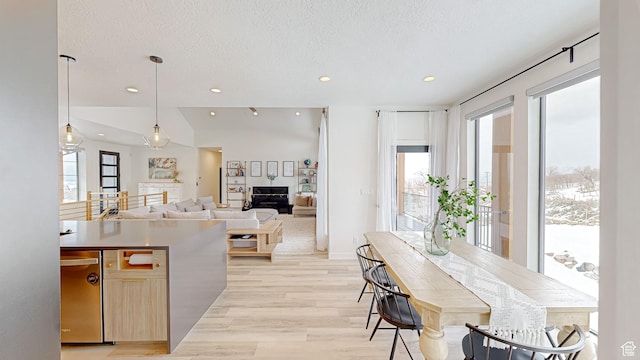 1244 N Washougal, Elk Ridge, UT 84651 - kitchen with a textured ceiling, recessed lighting, light wood-style floors, hanging light fixtures, and stainless steel dishwasher