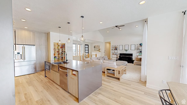 1244 N Washougal, Elk Ridge, UT 84651 - kitchen featuring stainless steel appliances, light wood finished floors, recessed lighting, a center island with sink, and a sink