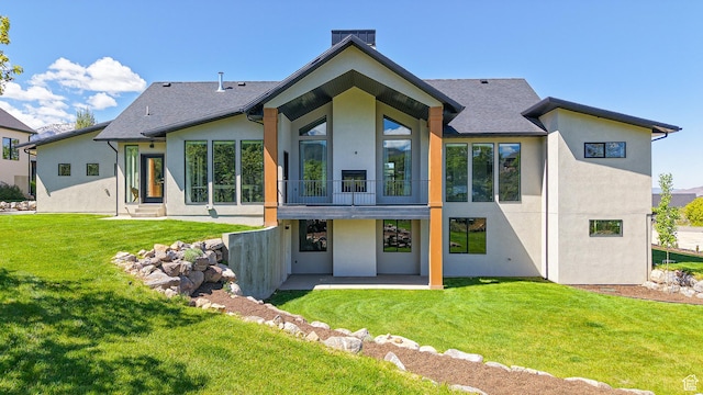 1244 N Washougal, Elk Ridge, UT 84651 - back of house featuring stucco siding, a patio, and a lawn
