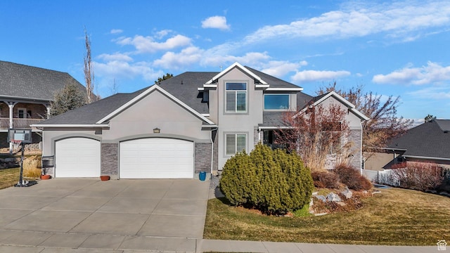 view of front property featuring a front yard and a garage