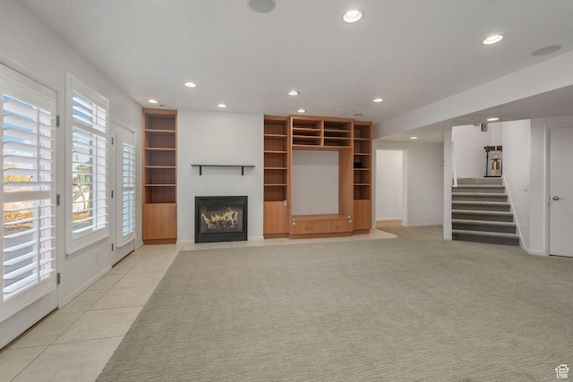 unfurnished living room featuring light tile patterned floors