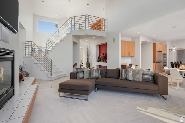 tiled living room with a towering ceiling