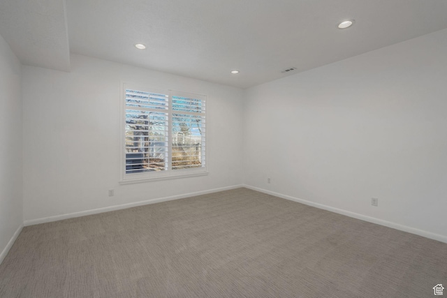 empty room featuring carpet flooring
