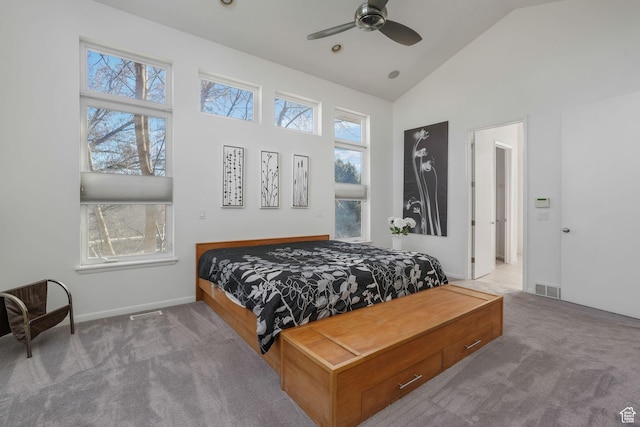 carpeted bedroom with high vaulted ceiling and ceiling fan