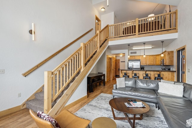 2653 Canyons Resort Dr Unit 223, Park City, UT 84098 - living room featuring light hardwood / wood-style floors and a towering ceiling