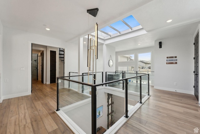 13599 S White Pony Rd W, Herriman, UT 84096 - corridor with light hardwood / wood-style flooring and a skylight