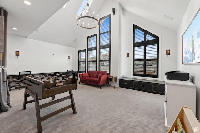 13599 S White Pony Rd W, Herriman, UT 84096 - rec room with light carpet, a notable chandelier, and high vaulted ceiling