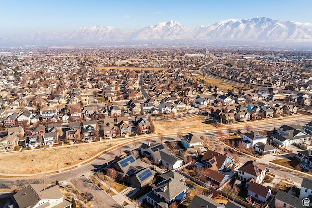 birds eye view of property with a mountain view and a residential view