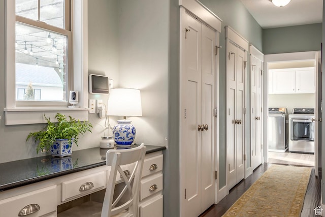 interior space featuring dark wood finished floors and separate washer and dryer