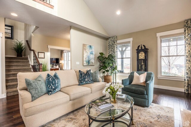 living room with dark wood finished floors, recessed lighting, stairs, and baseboards