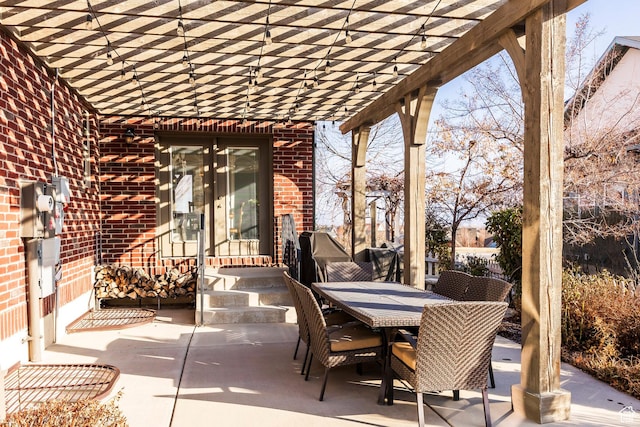 view of patio with a pergola and outdoor dining area