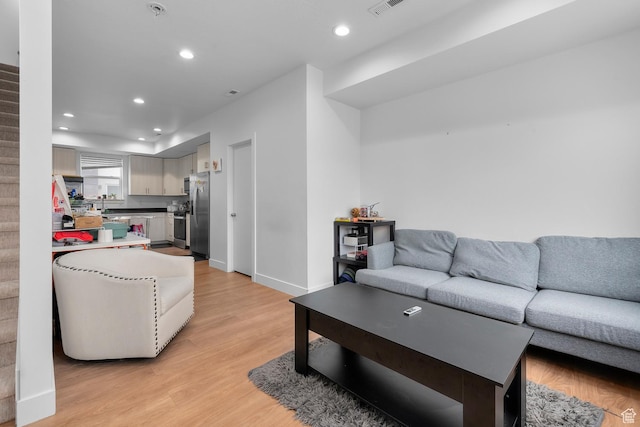 1570 S Main St Unit 102, Salt Lake City, UT 84115 - living room featuring light hardwood / wood-style flooring