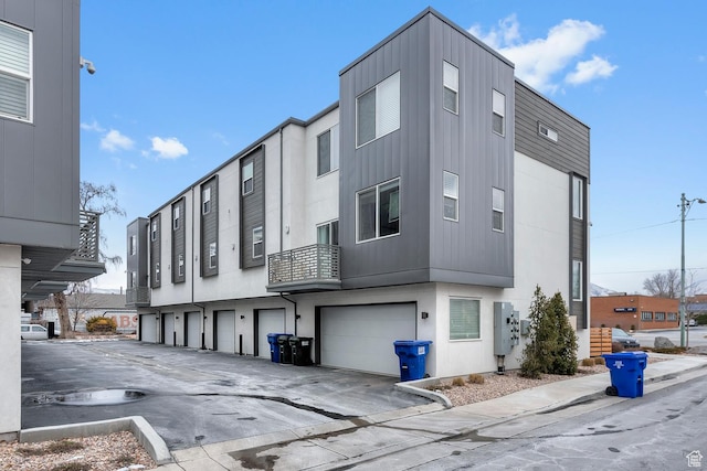 1570 S Main St Unit 102, Salt Lake City, UT 84115 - view of building exterior featuring a garage