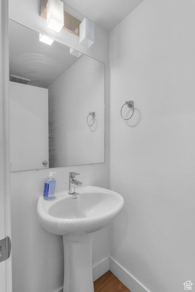 1570 S Main St Unit 102, Salt Lake City, UT 84115 - bathroom featuring hardwood / wood-style flooring