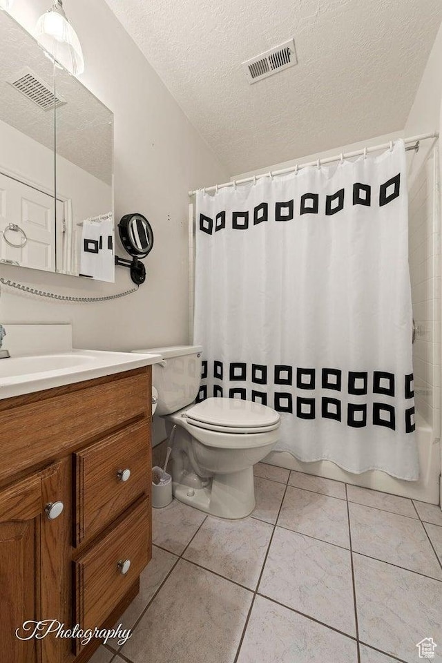 1050 W Red Hills Pkwy Unit 2, Washington, UT 84780 - full bathroom with toilet, a textured ceiling, tile patterned flooring, shower / tub combo, and vanity