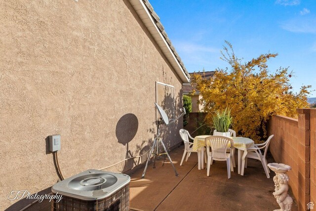 1050 W Red Hills Pkwy Unit 2, Washington, UT 84780 - view of patio featuring central AC unit
