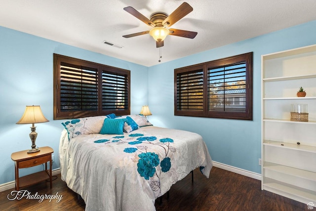 1050 W Red Hills Pkwy Unit 2, Washington, UT 84780 - bedroom with ceiling fan and dark hardwood / wood-style floors