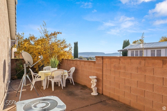 1050 W Red Hills Pkwy Unit 2, Washington, UT 84780 - view of patio / terrace featuring cooling unit and a mountain view