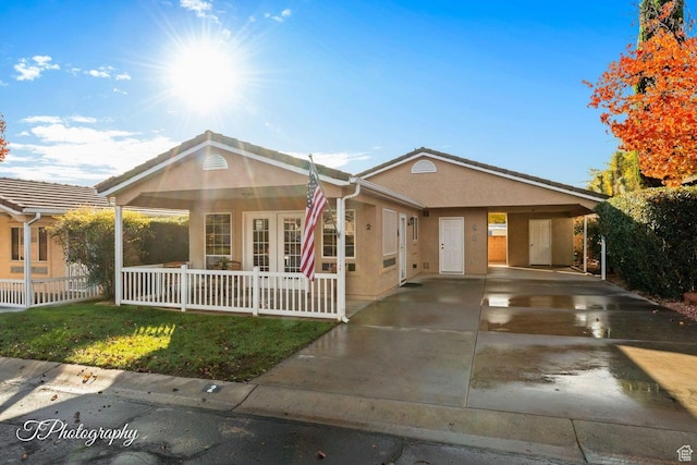 1050 W Red Hills Pkwy Unit 2, Washington, UT 84780 - single story home featuring covered porch and a carport