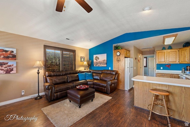 1050 W Red Hills Pkwy Unit 2, Washington, UT 84780 - living room with dark hardwood / wood-style flooring, ceiling fan, and vaulted ceiling