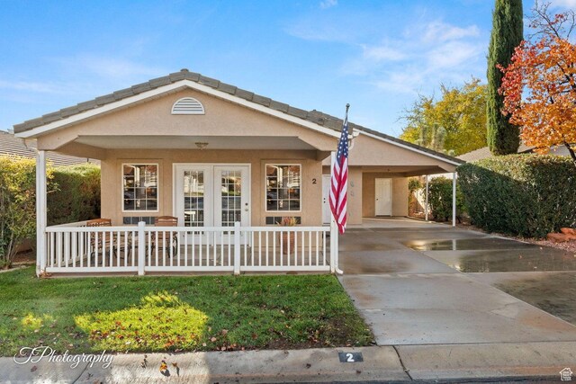 1050 W Red Hills Pkwy Unit 2, Washington, UT 84780 - ranch-style home with a porch and a carport